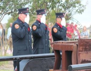 Firefighters saluting
